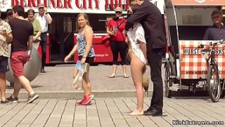 Petite Euro brunette babe Juliette March made by her master Steve Holmes walking with gag ashtray and exposing pussy to evryone in public